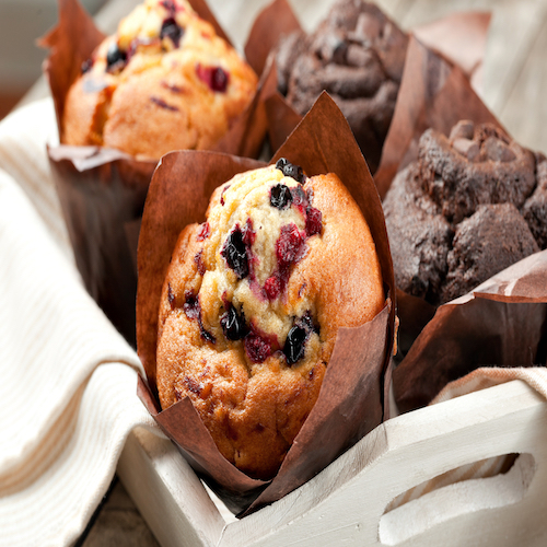 blueberry and chocolate muffins in paper cupcake holder
