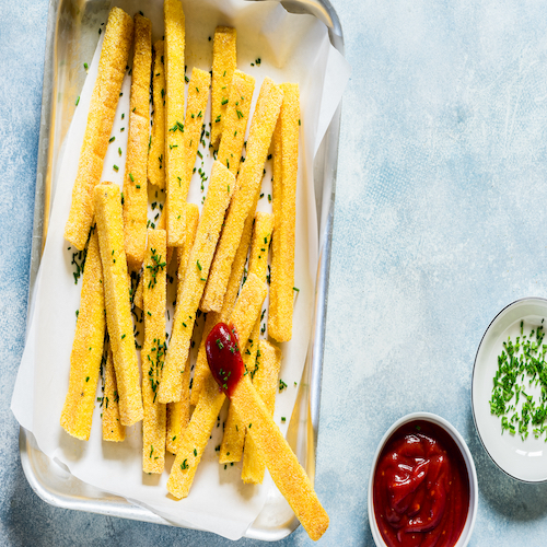 Polenta Chips with Tomato Sauce and Chives, copy space for your text