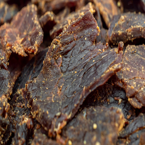 Beef jerky. Close up. Food background.