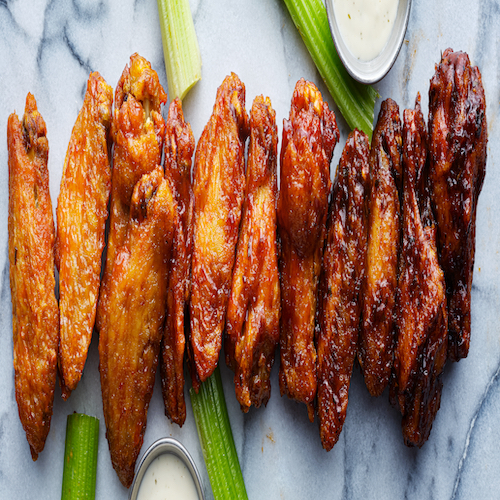 line of buffalo chicken wings drenched in different sauces
