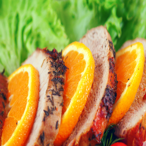 fresh juicy steak sliced, with orange peel and vegetable